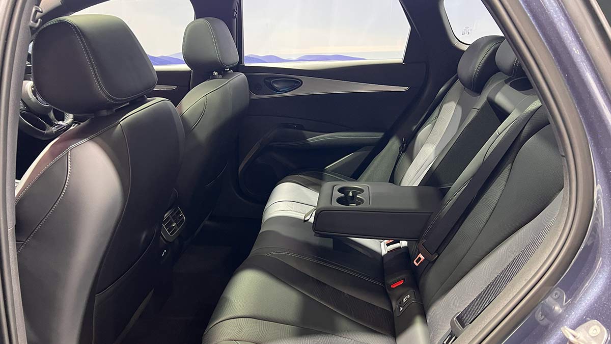 Rear seat area of BYD Seal 6 Touring wagon with centre armrest folded down to show twin cupholders.