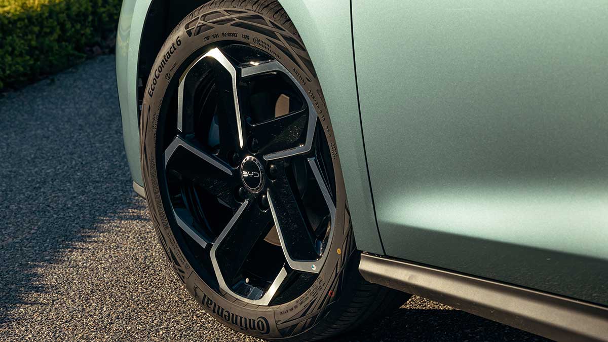 Detail image of sage green BYD Seal 6 Touring with 18-inch alloy wheel and Continental tyre.