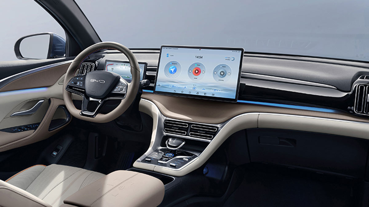 Driver's seat area with large screen and wide console in BYD Sealion 5 SUV.