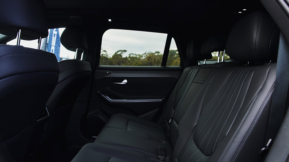 Second row of BYD Sealion 8 seven-seater SUV with dark leather seat trim and chrome highlights on doors.