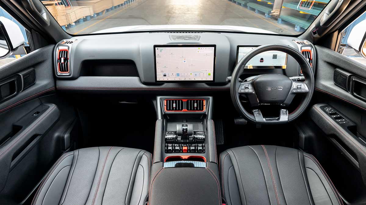 Dashboard of BYD Shark 6 Cab Chassis with dual digital screens and dark synthetic leather trim.