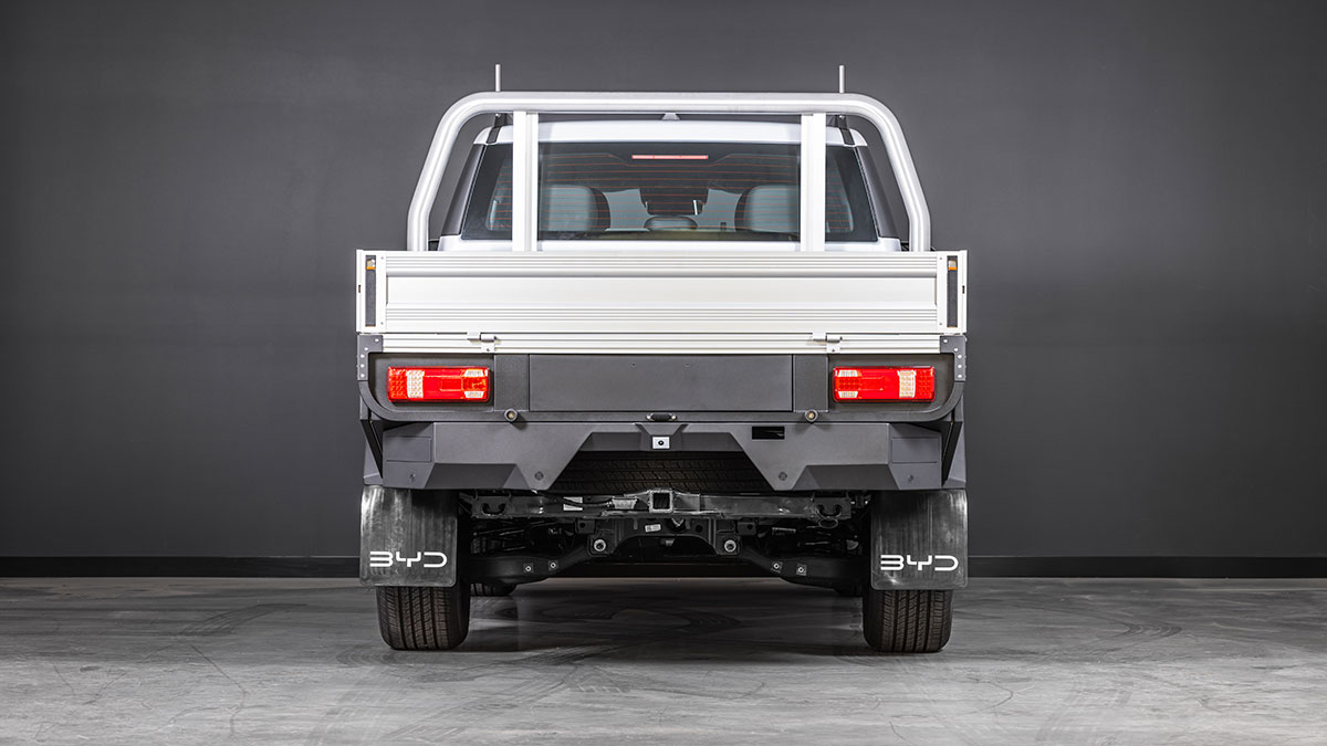 Rear view of BYD Shark 6 Cab-Chassis dual-cab ute with tow bar connection and alloy tray.