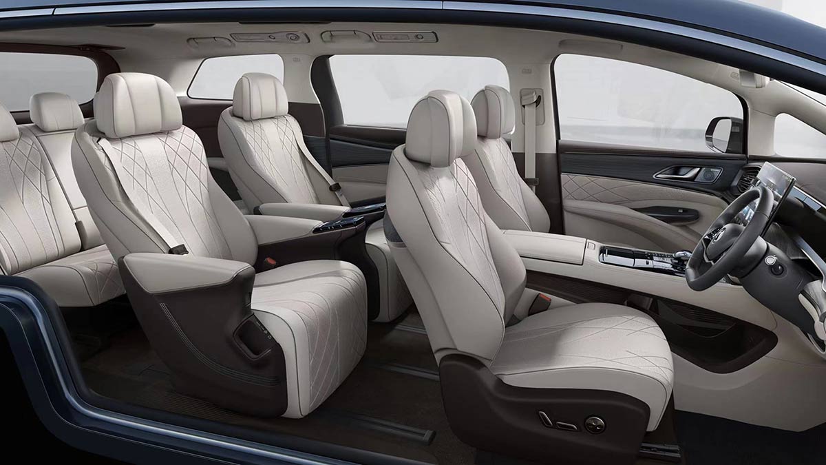 Cutaway image of Denza D9 luxury MPV’s three-row cabin with plush cream trim and twin individual seats in row two.