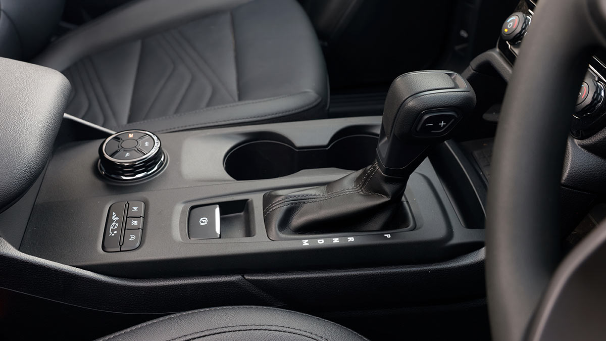 Centre console of Ford Everest Active SUV with transmission lever, 4WD selector and terrain mode buttons.