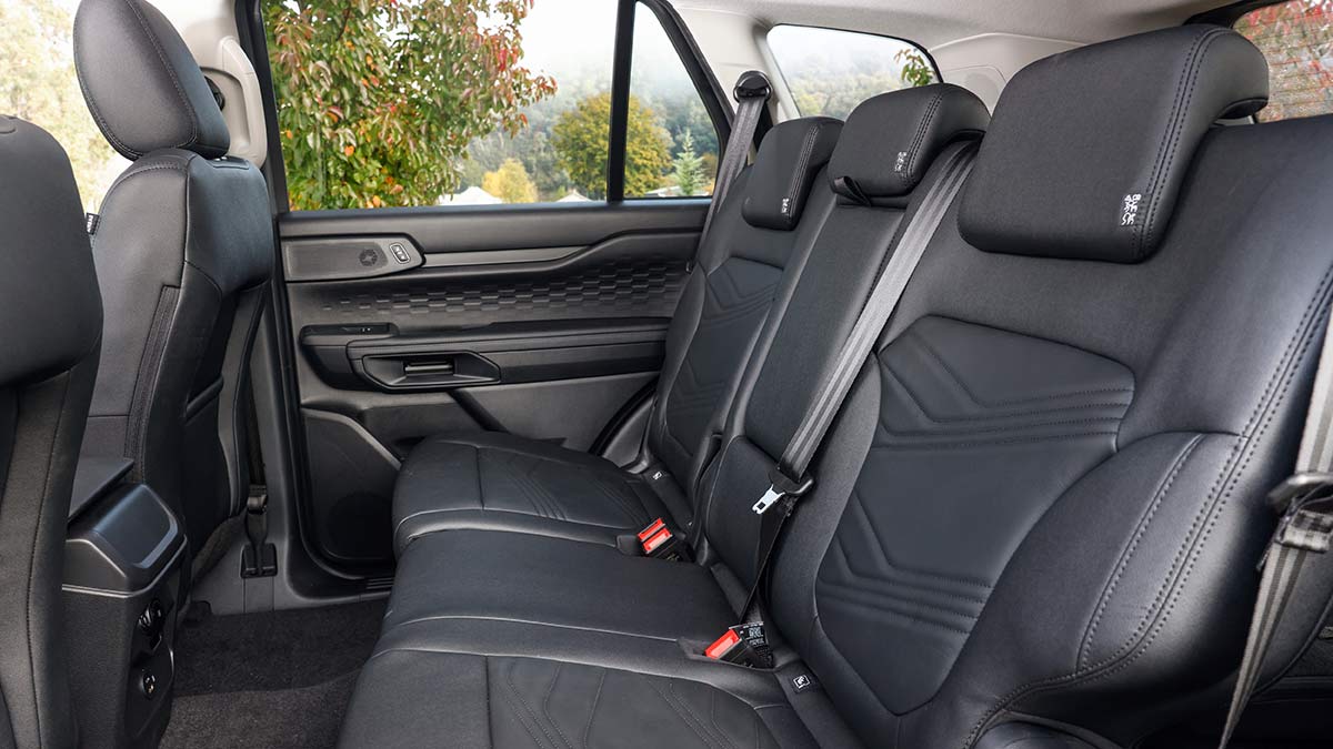 Second row seat of Ford Everest Active SUV with dark leather-accented trim.