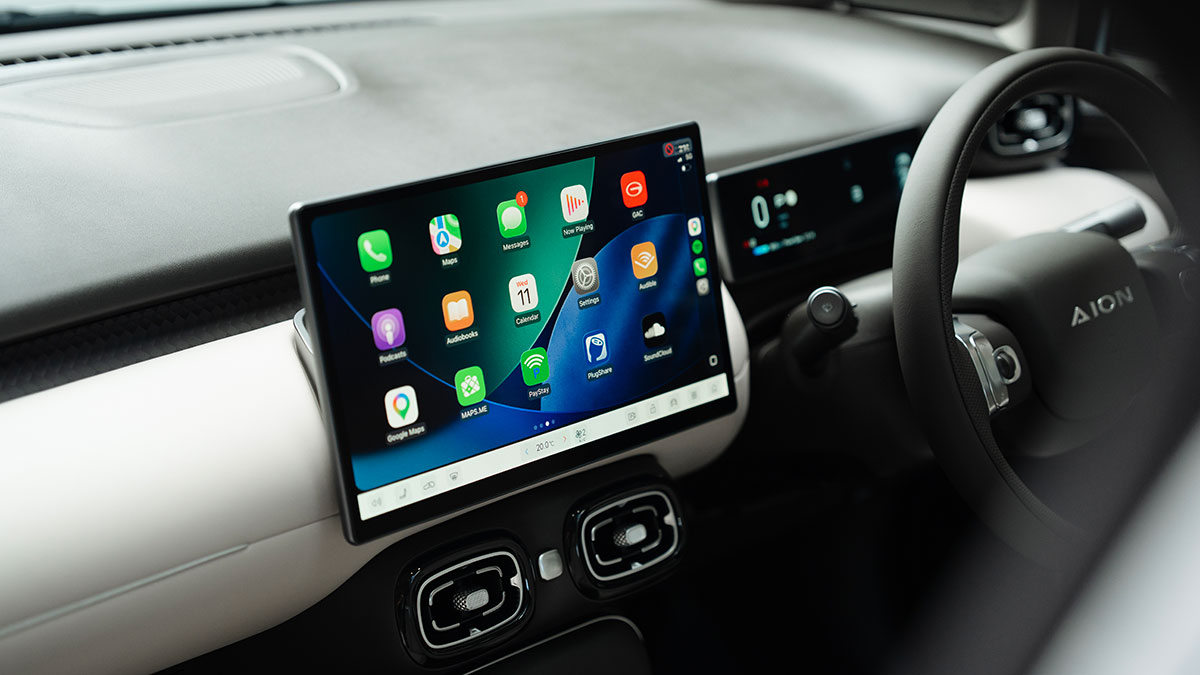 14.6-inch central touchscreen on two-tone cream/charcoal dash of GAC Aion UT electric hatch.