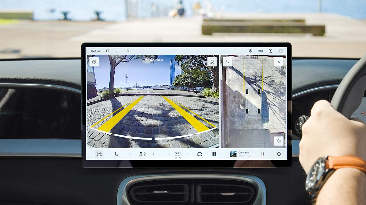 Central touchscreen in Geely EX2 showing rear-view and overhead camera views.