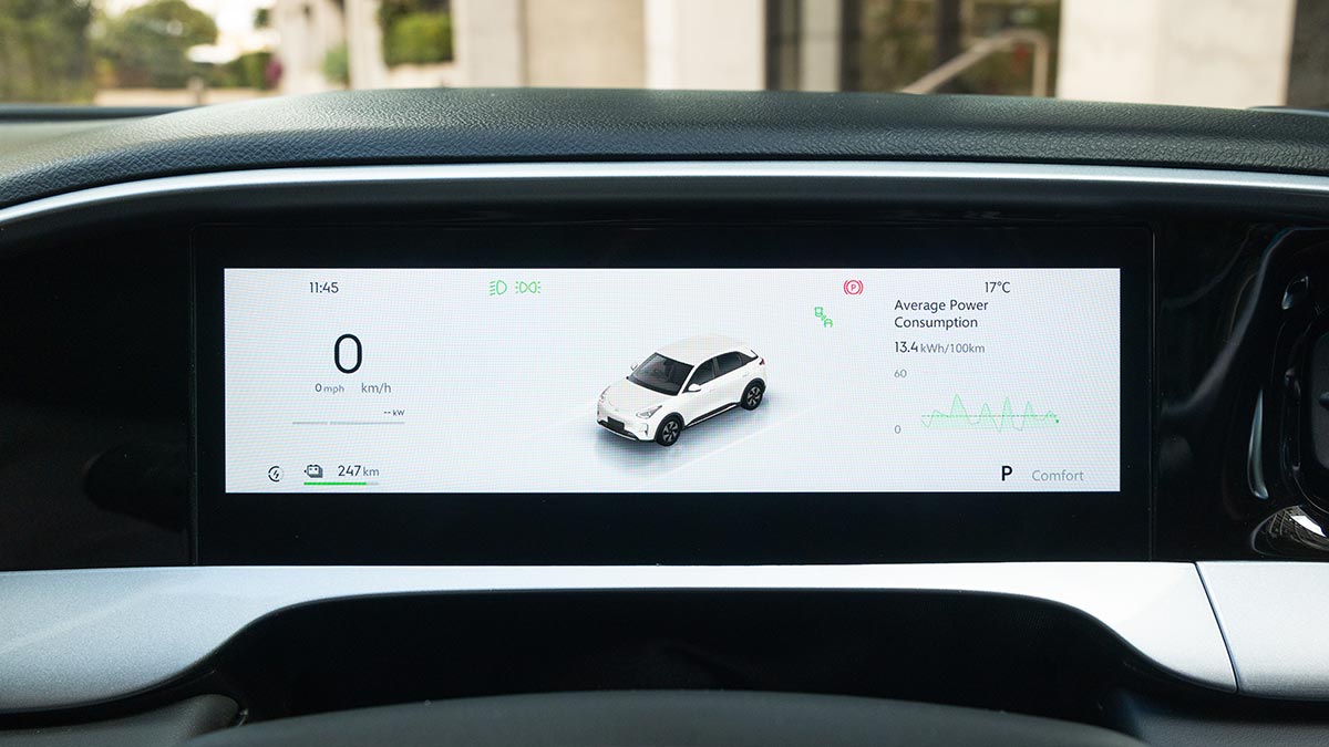 Digital driver's screen in Geely EX2 showing car graphic, speed, power consumption and more.