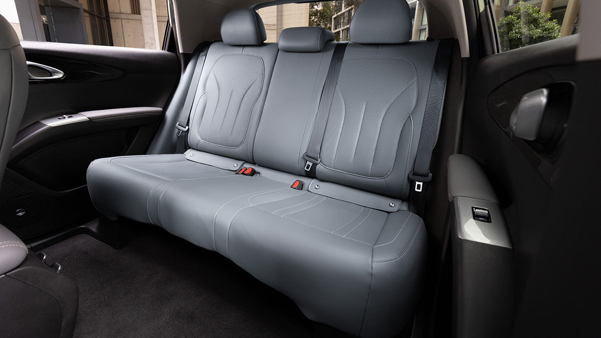 Rear bench seat in Geely EX2 electric hatch with grey synthetic leather trim.