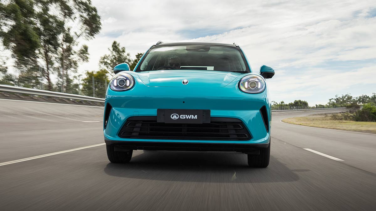 Frontal shot of duck-egg blue GWM Ora 5 electric small SUV on high-speed bowl at Lang Lang proving ground in Victoria.