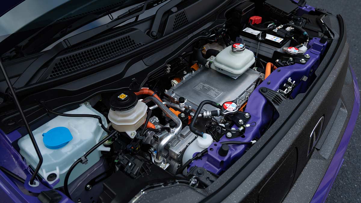 Electric motor powertrain under bonnet of Honda Super-One compact EV hatch.