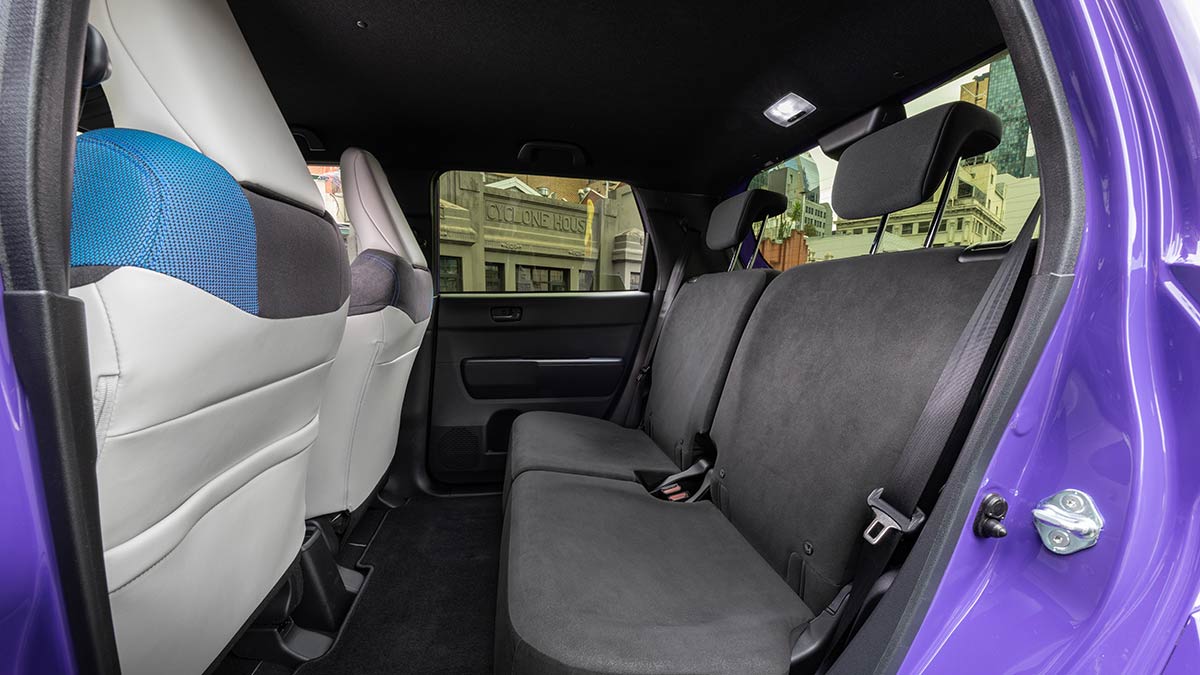 Rear seat area of Honda Super-One EV hatchback with grey seat trim.