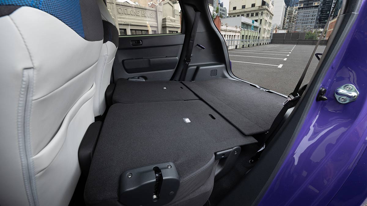 View of cargo area of Honda Super-One with seats folded, as seen from left-rear door.
