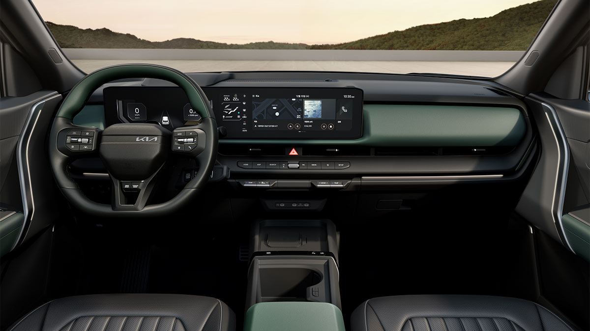Dark, sporting interior of Kia Seltos X-Line SUV with charcoal grey and dark green trim.