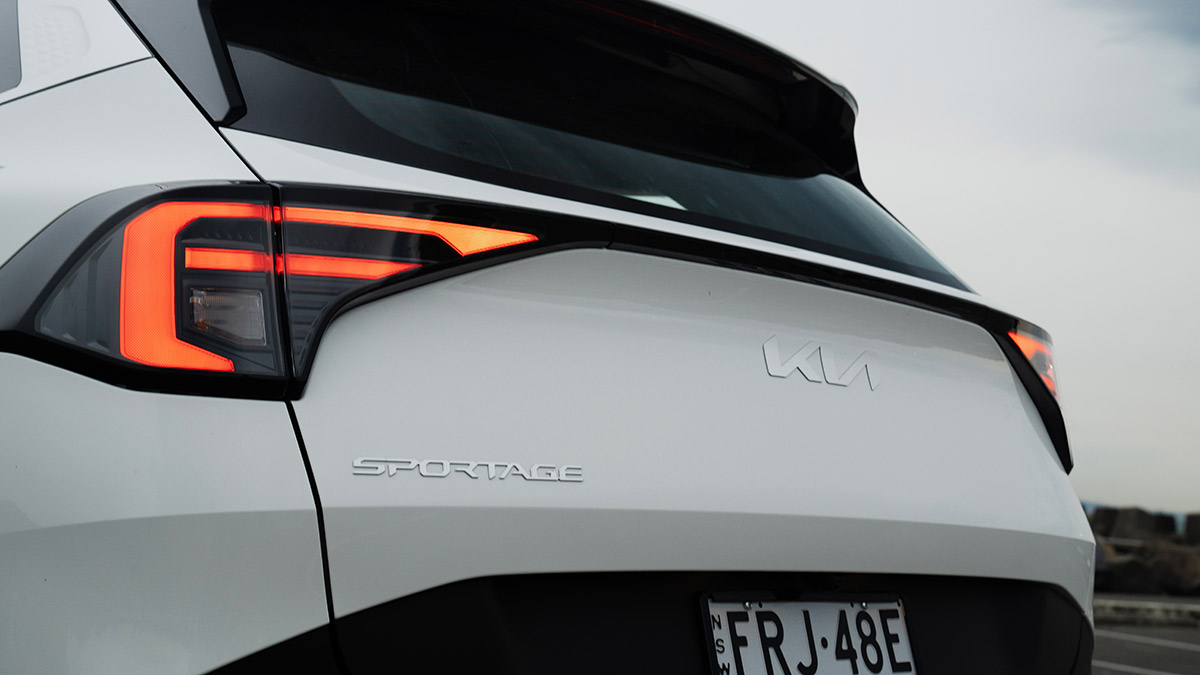Rear end of white Kia Sportage S medium SUV