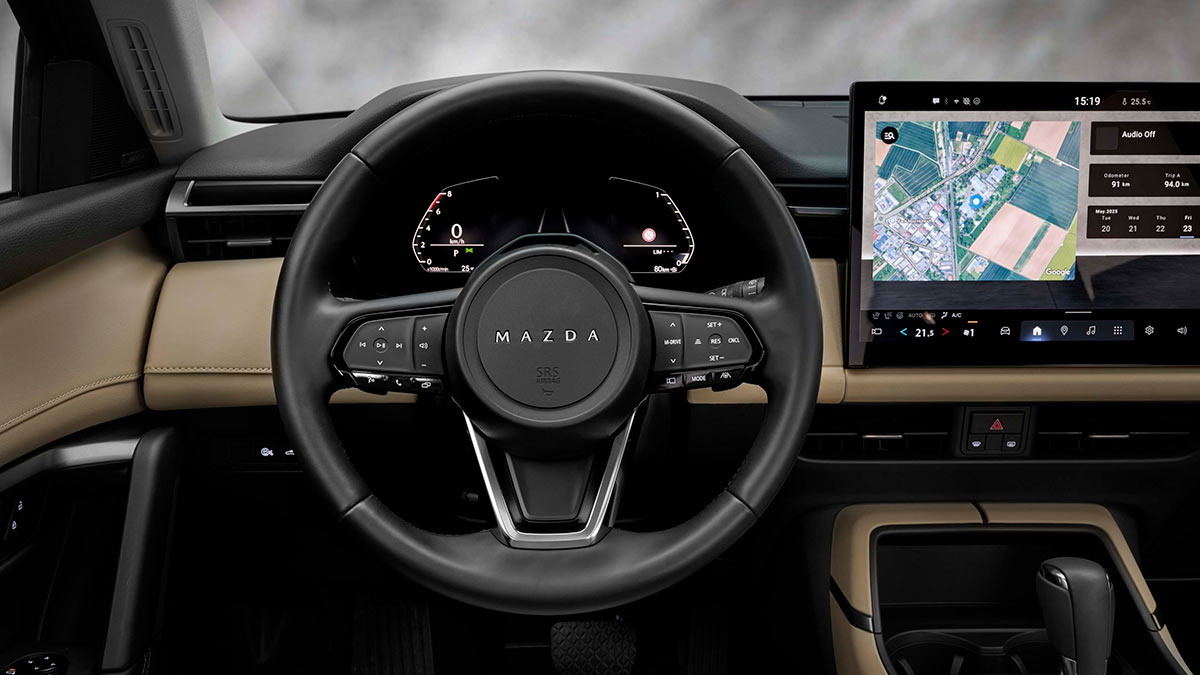 Mazda CX-5 SUV with new steering wheel, digital instrument panel and large central touchscreen with integrated Google Maps.