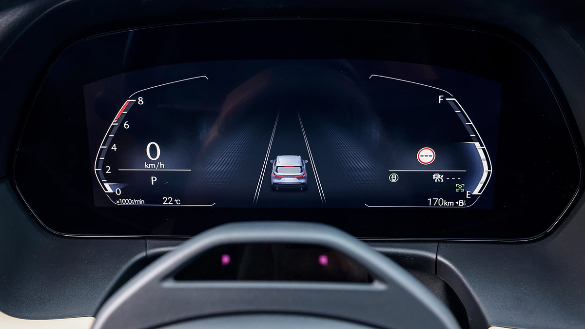 10.25-inch digital driver’s instrument display in Mazda CX-5 SUV with central graphic of car in lane.