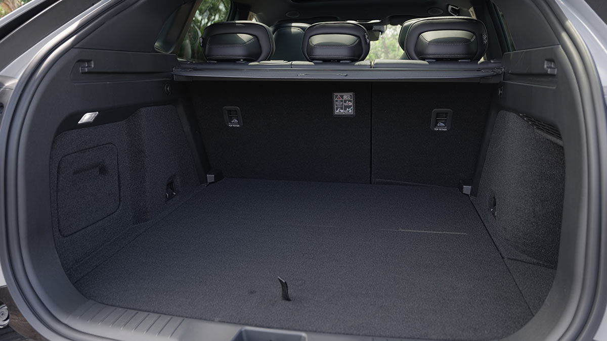 Deep cargo area in Mazda CX-6e five-seater medium SUV with rear seats upright.