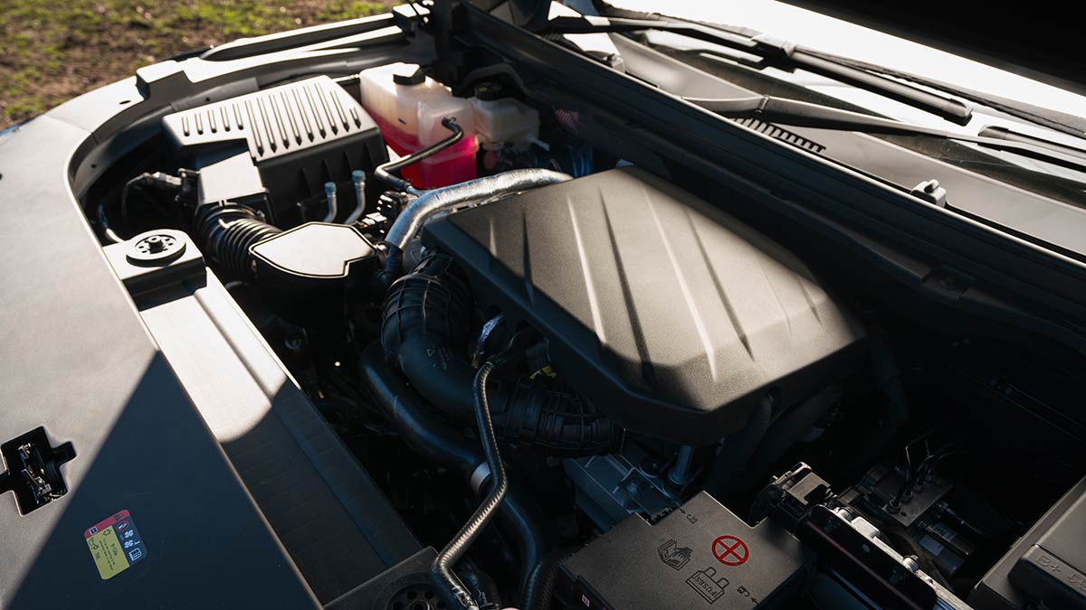 Diesel engine under bonnet of MG U9 ute.