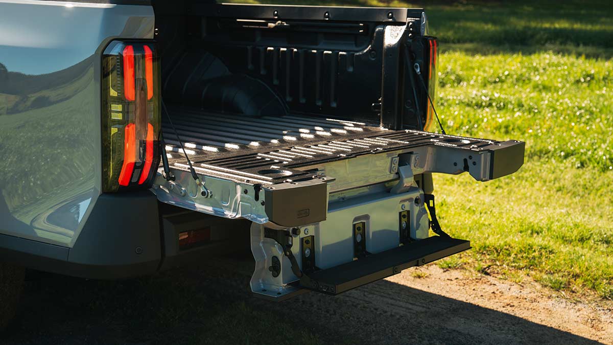 Electric tailgate down on MG U9 Explore Pro ute with manual-operated step also lowered. 