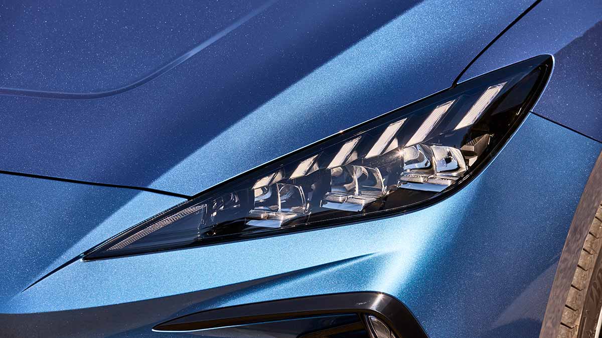 Close-up of sharply angled LED headlight at front left of MG4 electric hatchback.