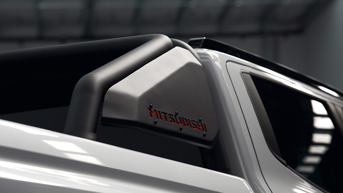 Grey metallic sports bar with red Mitsubishi name on Triton Raider ute.