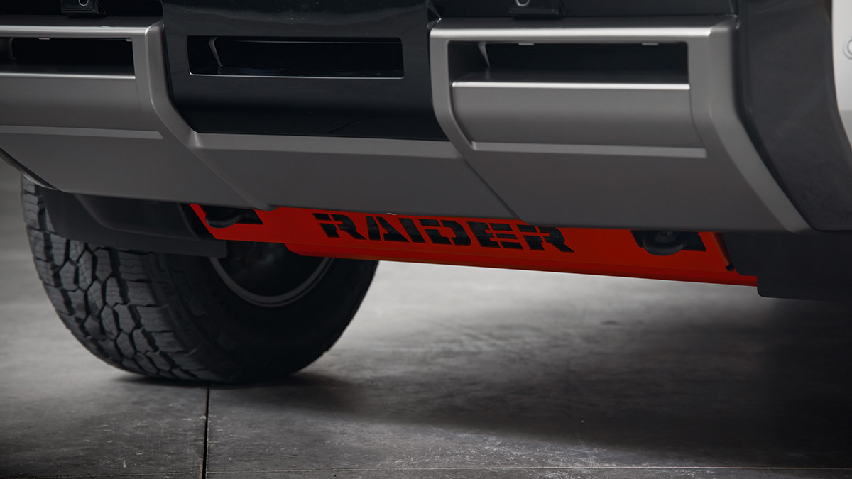 Red Raider-branded bash plate underneath front end of Mitsubishi Triton Raider ute.