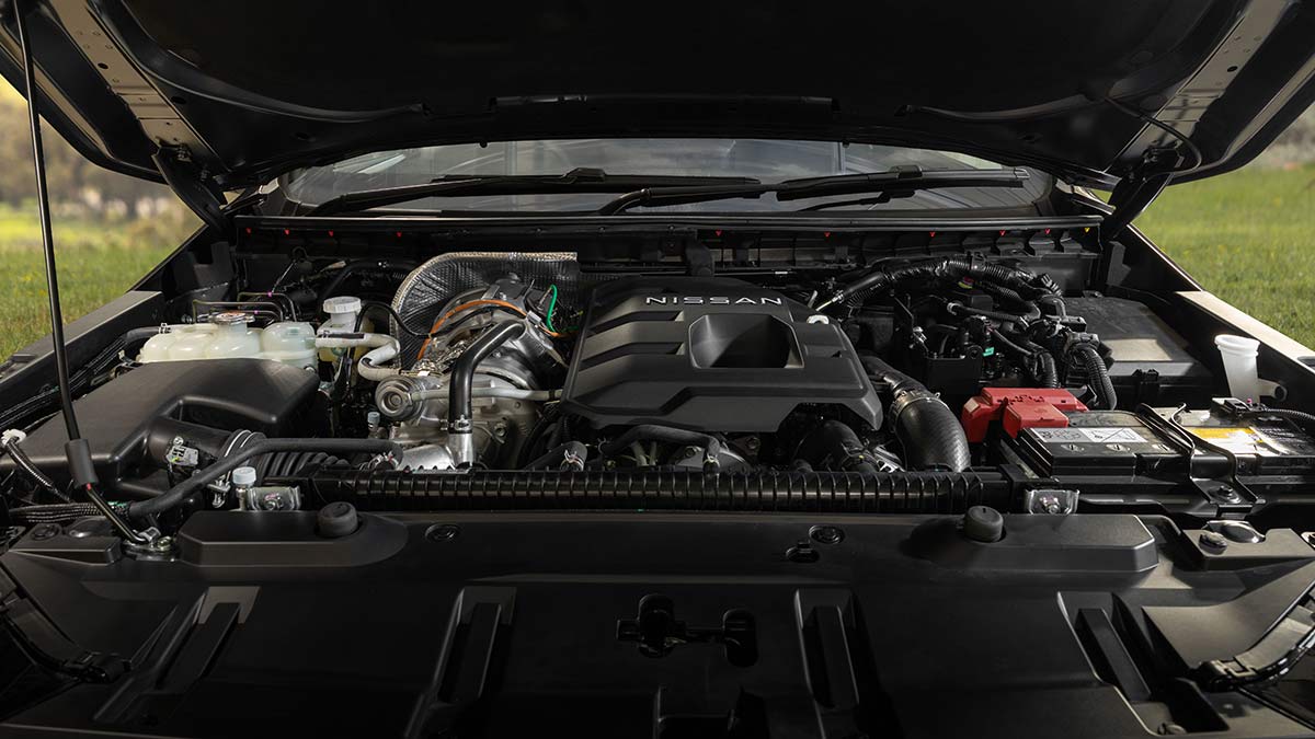 View of Mitsubishi-sourced diesel engine under bonnet of Nissan Navara ST-X ute.