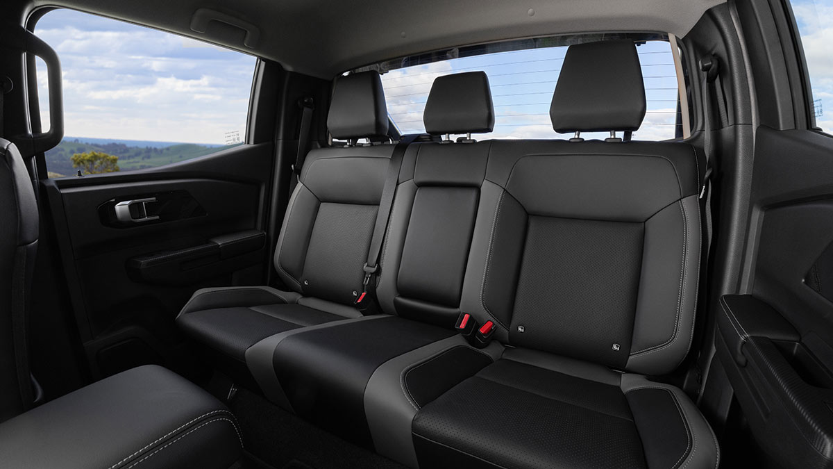 Rear seat area showing two-tone grey seats in Nissan Navara ST-X dual cab.