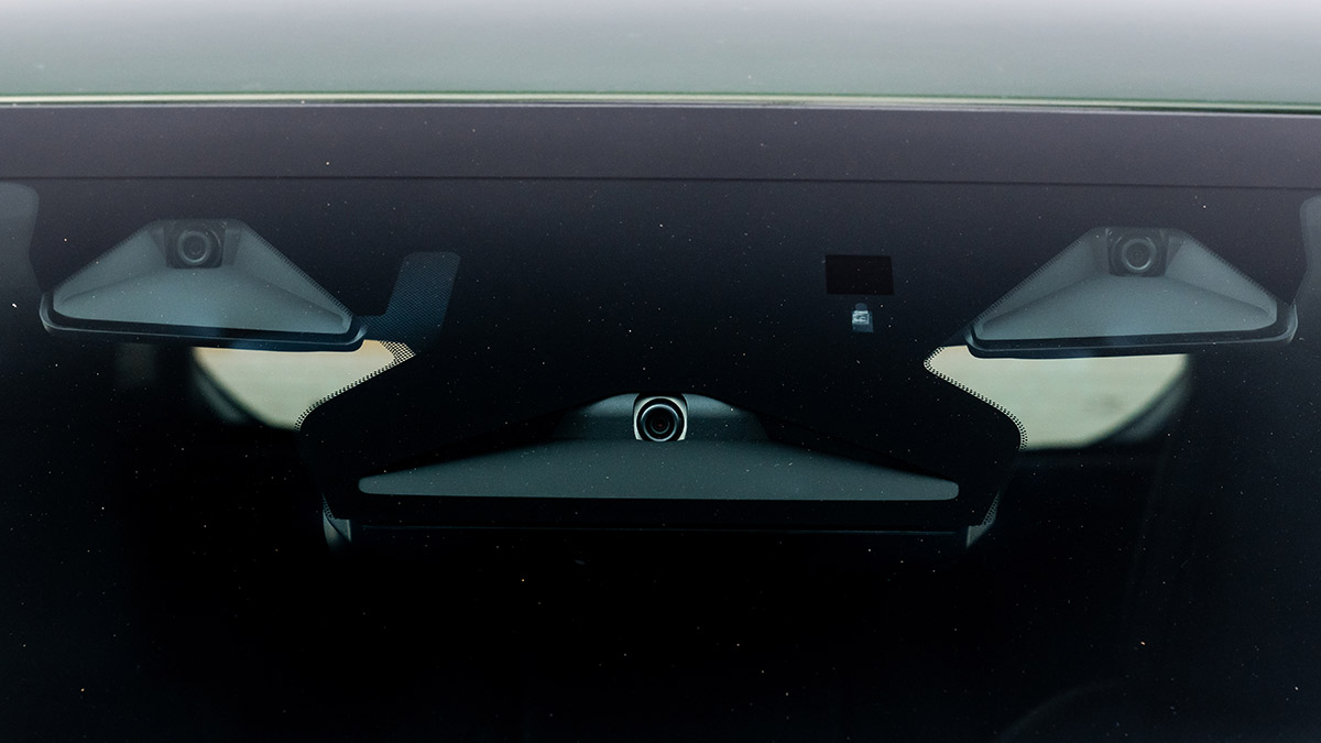 View of three safety cameras behind windscreen of new Subaru Outback SUV.
