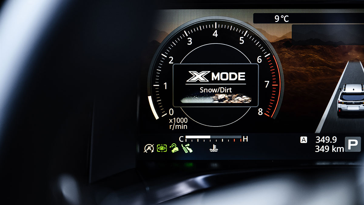 Digital instrument display in Subaru Outback showing X-Mode Snow/Dirt terrain mode setting.