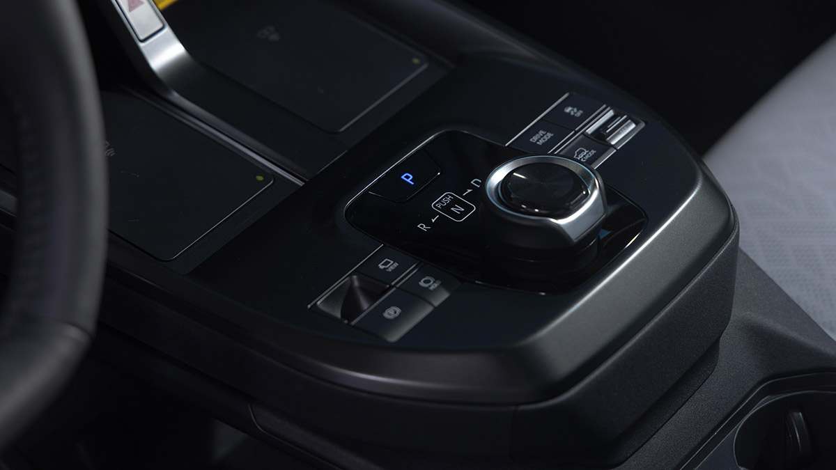 Centre console of Subaru Uncharted SUV with rotary transmission controller and twin wireless phone charging pads.
