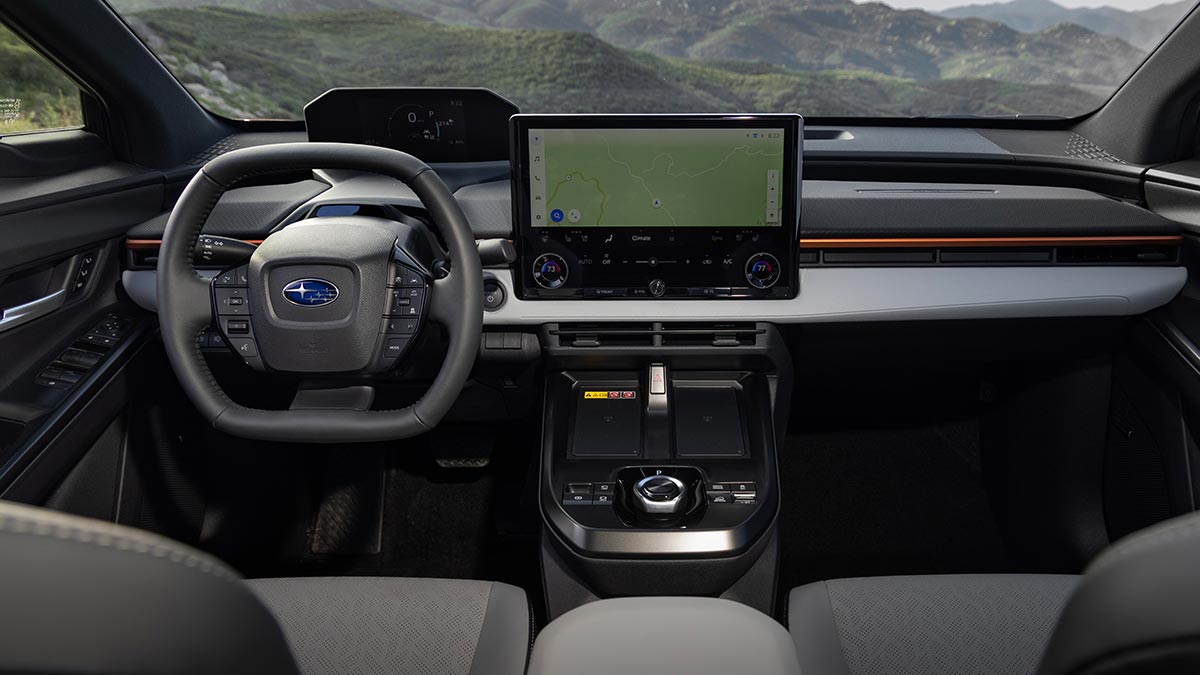 Dashboard of LHD US-spec Subaru Uncharted small electric SUV with twin digital screens and oval-shaped steering wheel.