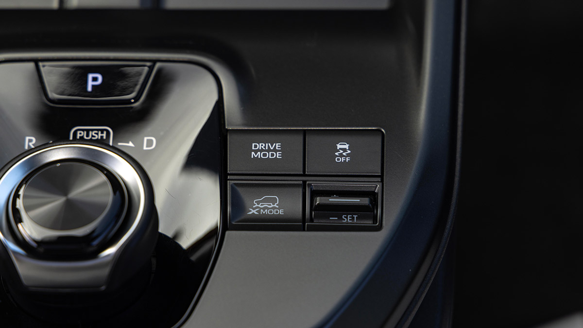 Detail image of centre console on Subaru Uncharted SUV with rotary transmission controller and drive mode buttons.