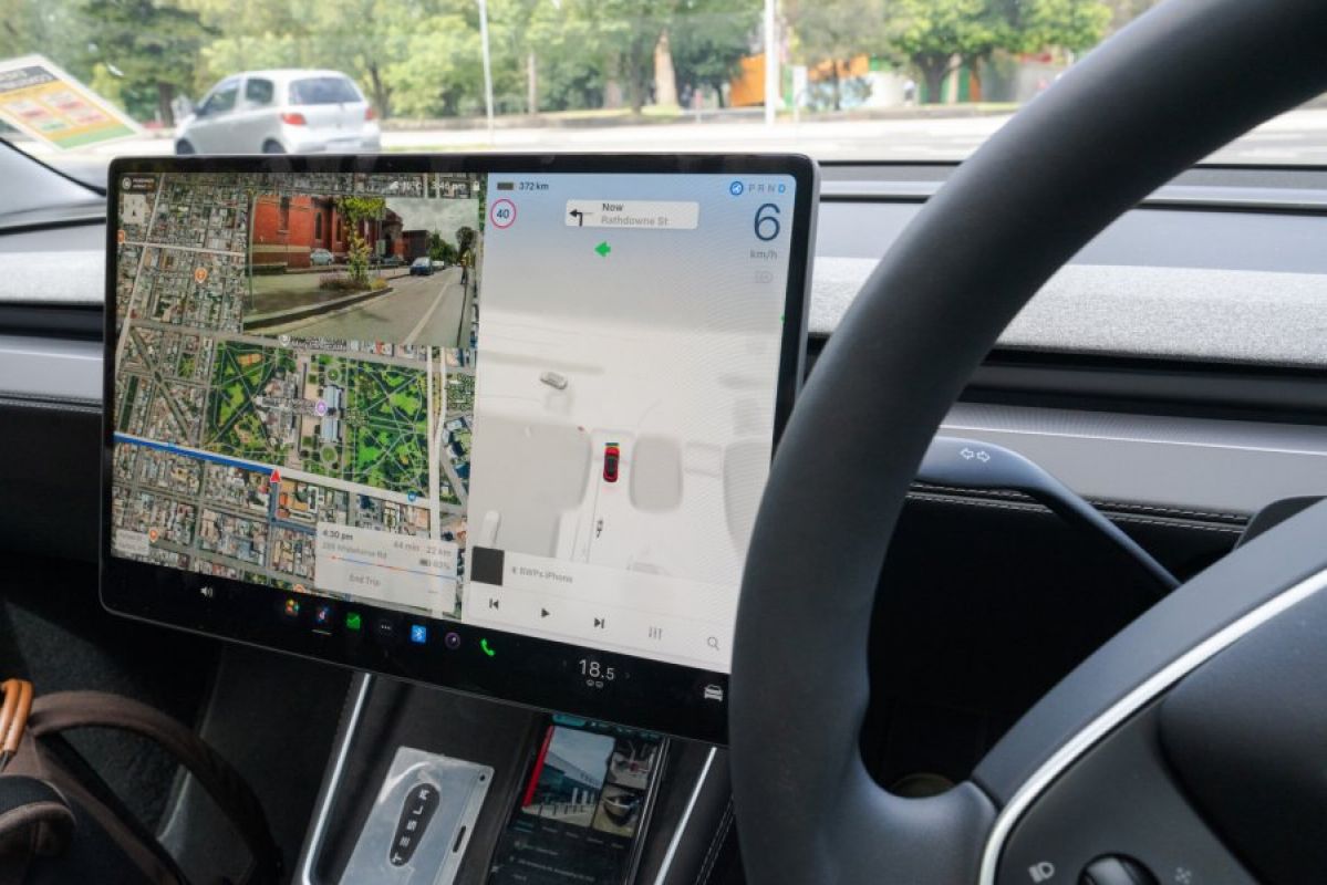 A close-up of the 2026 Tesla Model Y infotainment screen while the vehicle is in full self-driving (supervised) mode
