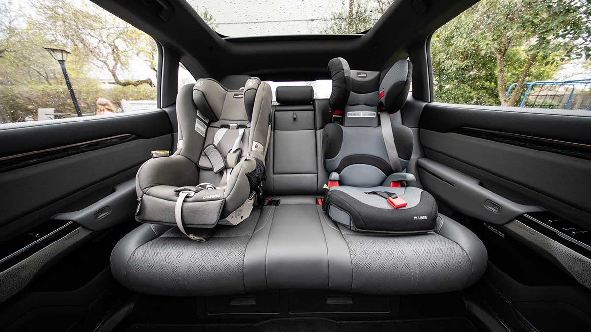 Rear seat of Zeekr 7X electric SUV with child restraints in outboard positions, as seen from front seat area.