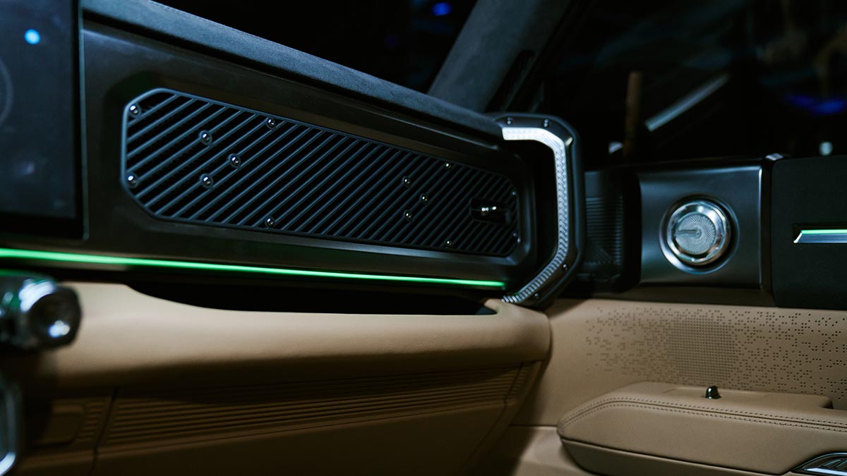 Ambient interior lighting and tough truck styling cues in front seat area of Chery KP31 ute.