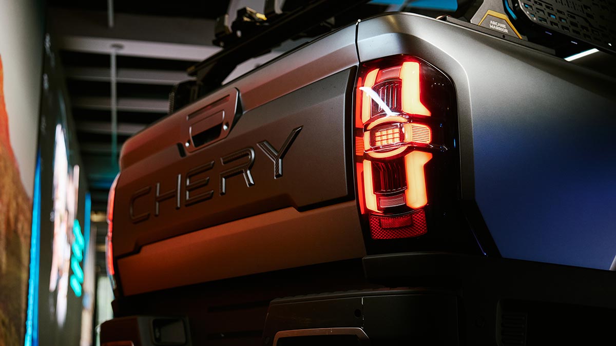 Rear end of silver Chery KP31 dual cab ute prototype with Chery branded on tailgate and LED tail-lights.