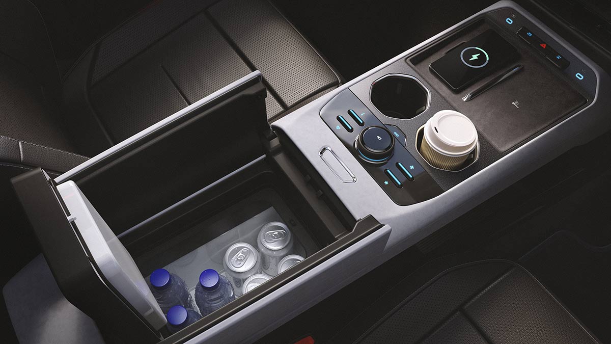 Centre console of Ford Bronco Basecamp with lid of cooled storage box open, showing drinks cans and bottles inside.
