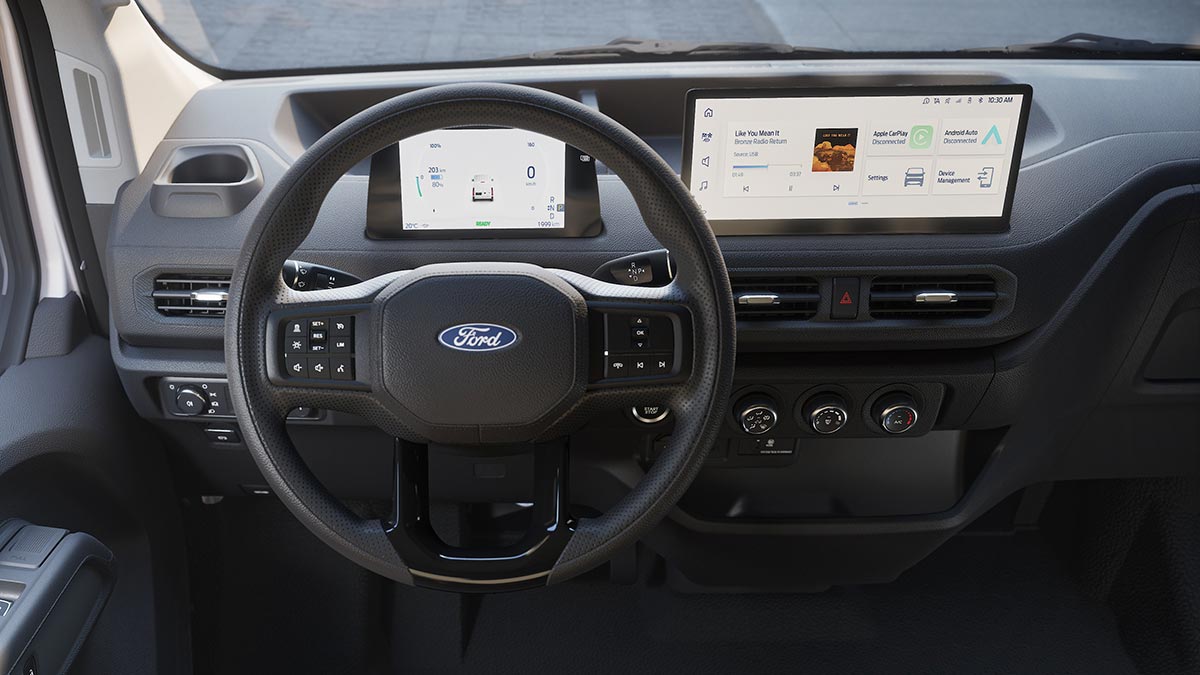 Dashboard of left-hand-drive Ford Transit City electric van with dual digital screens and multi-function steering wheel.