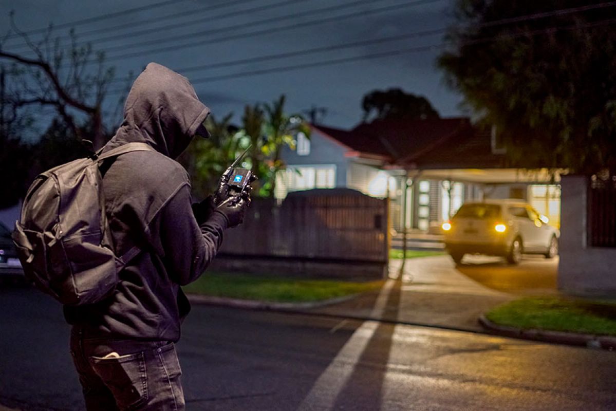 Garage with open door and expensive contents