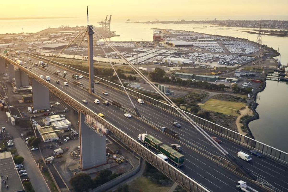 An aerial photo of cars travelling over the Westgate Bridge at sunset