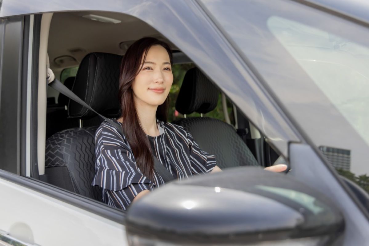 young woman driving car