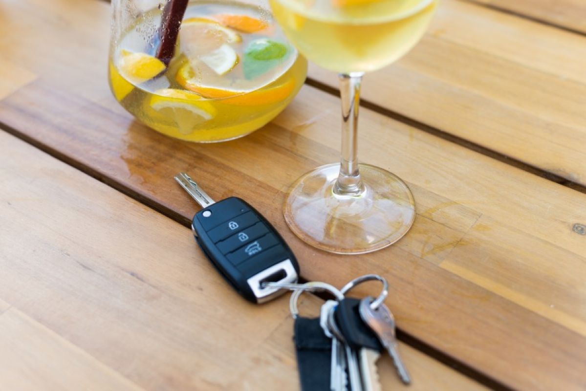 alcoholic drinks with car keys on table