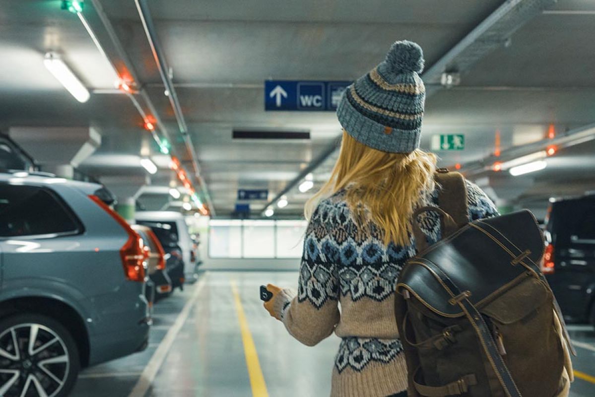 woman walking in underground parking lot