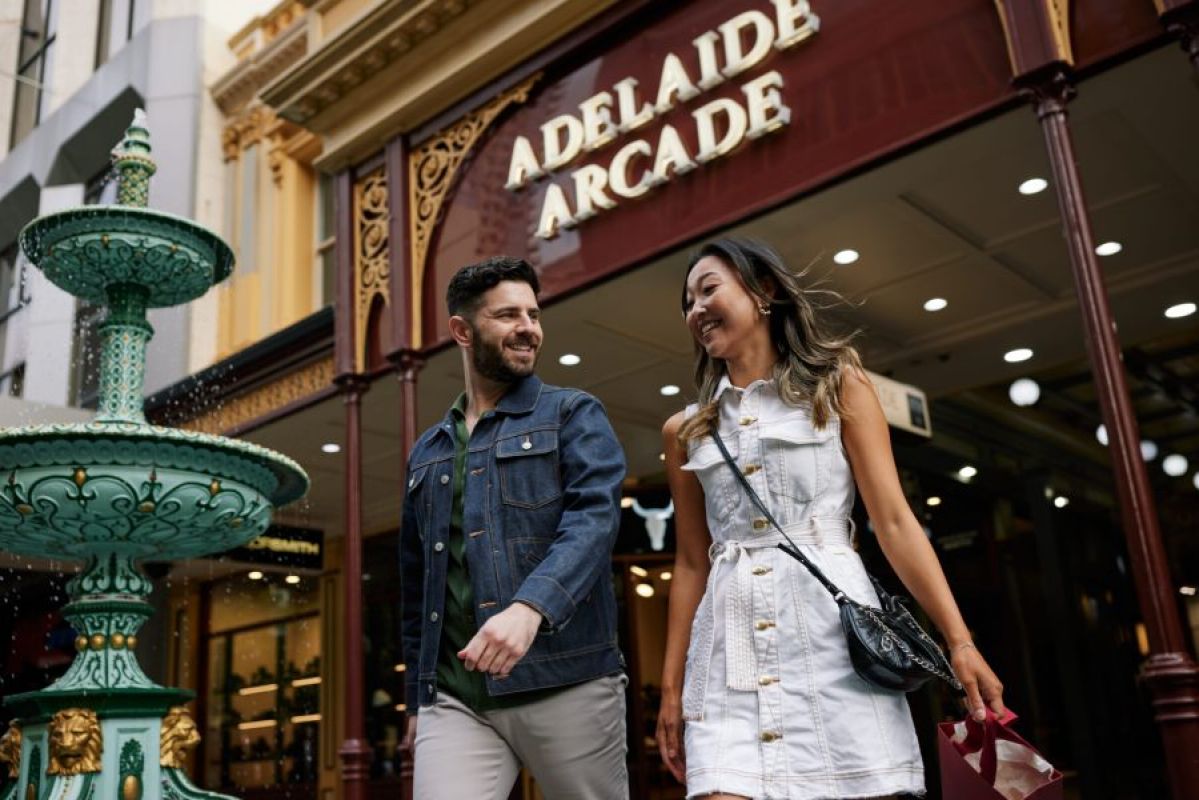 woman and man exiting Adelaide Arcade