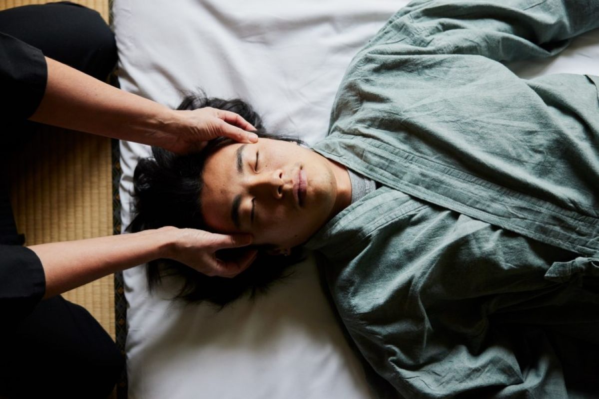 young man getting head massage