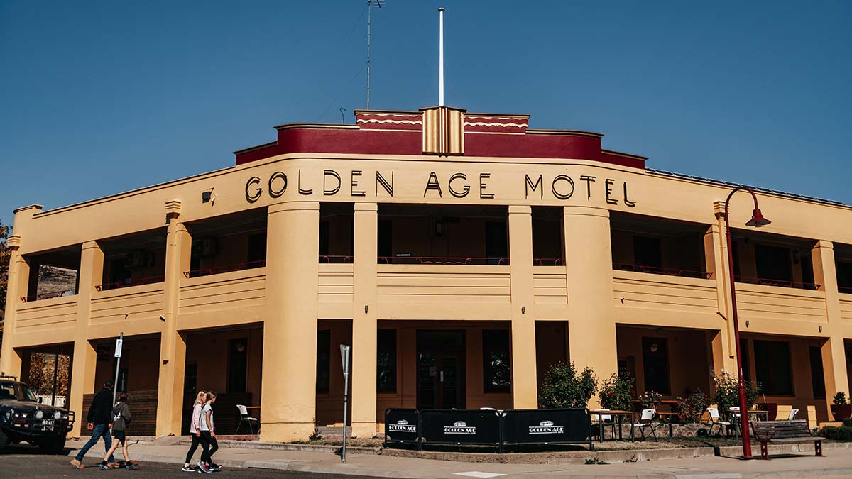 Golden Age Motel with bright golden art deco facade
