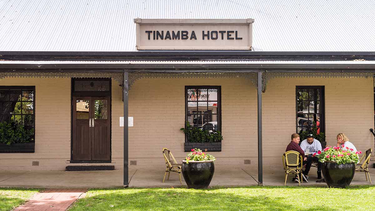 People sitting outside Tinamba Hotel
