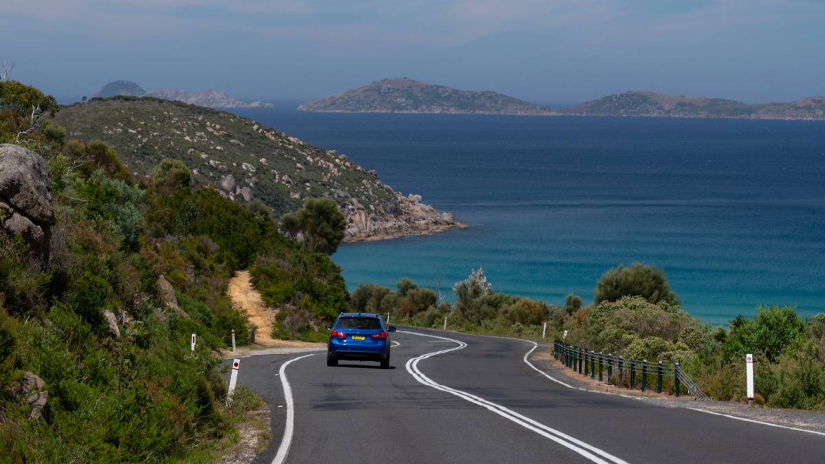 car driving on scenic ocean road
